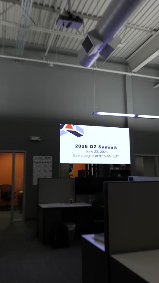 Corporate summit: in-room video walls plus a live stream to remote employees