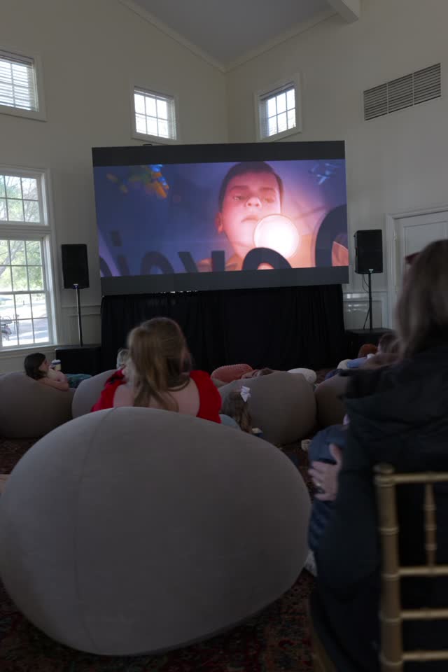 Holiday family movie day in a club ballroom: video wall and sound