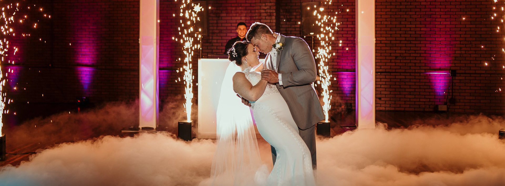 Couple dancing on the clouds as cold sparks go off