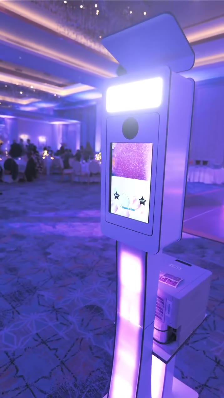 ATG classic photo booth kiosk with uplighting in a ballroom