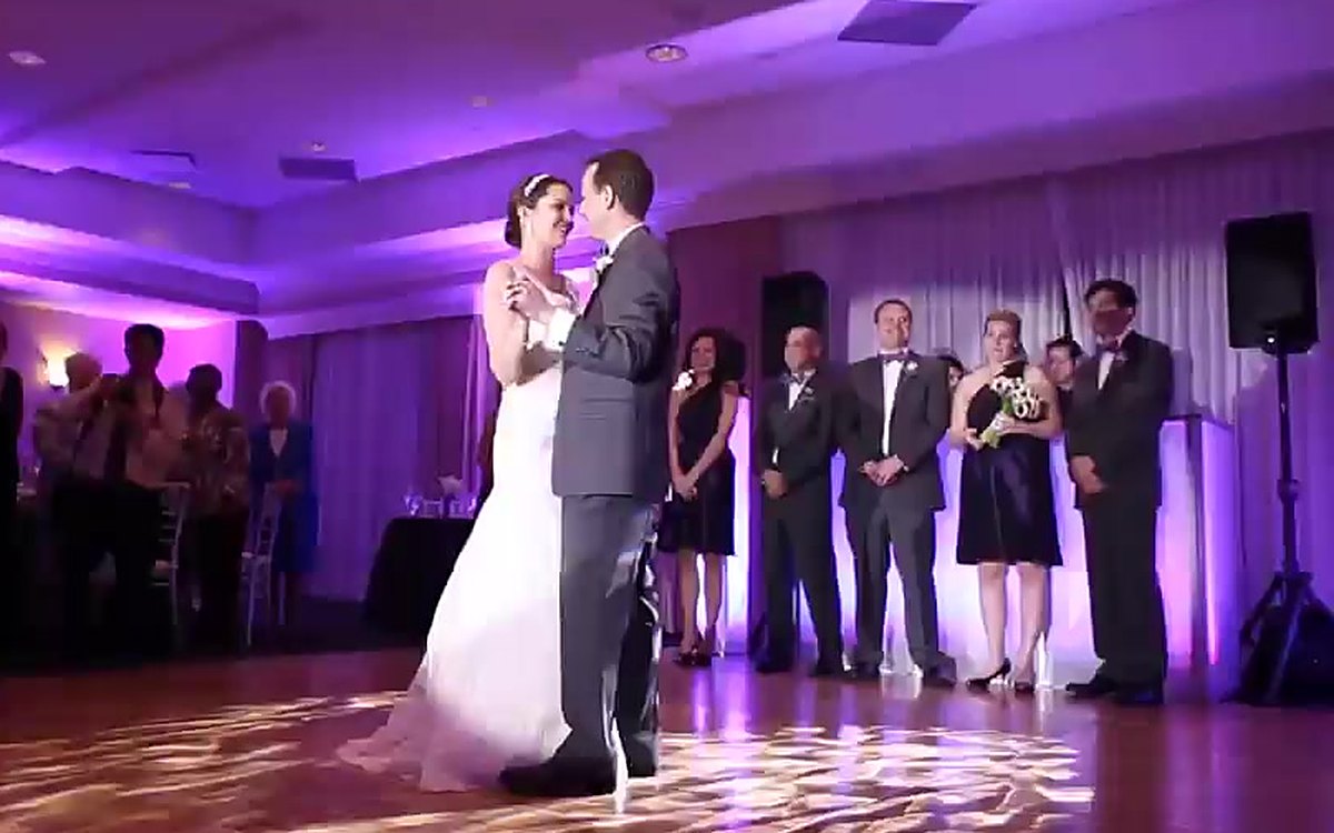 A first dance under purple ATG uplighting at The Ballantyne Hotel