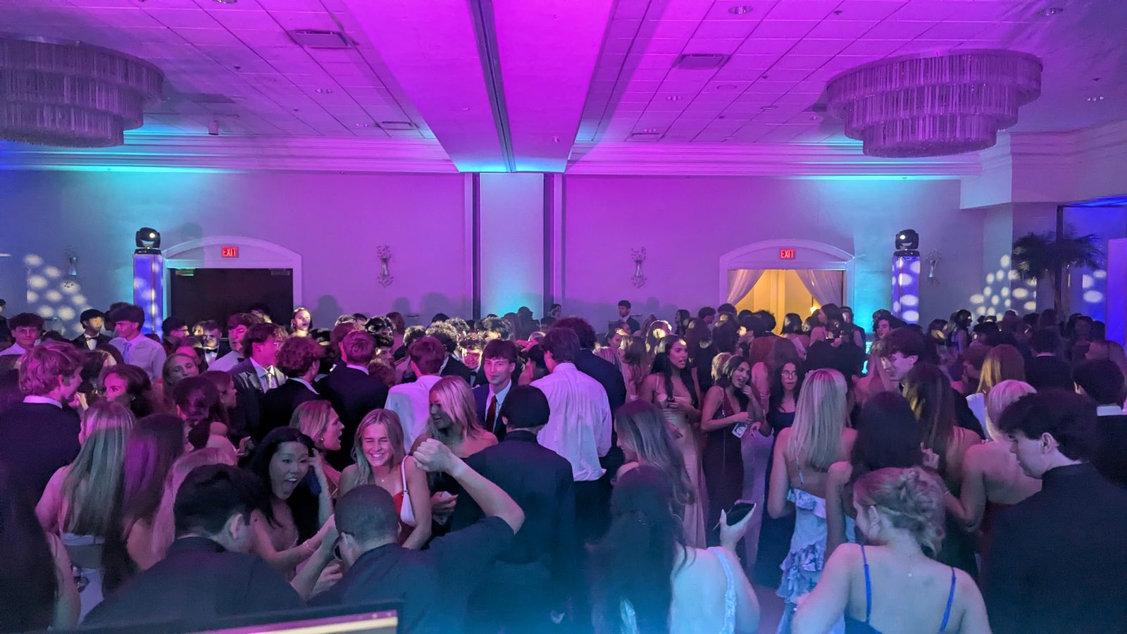Hands up on a packed prom dance floor