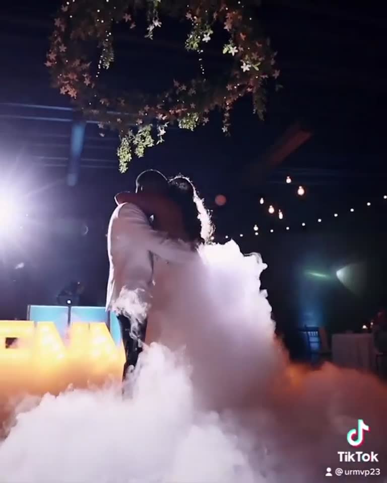 Dancing on the clouds under string lights