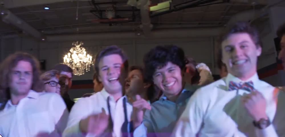High school guys in shirts and ties dancing at homecoming