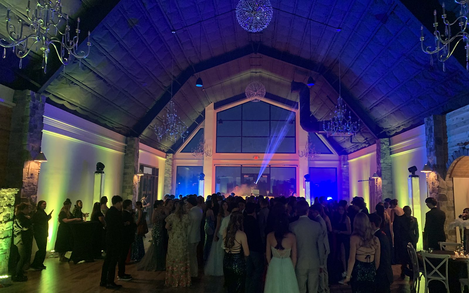 Uplighting and beam lights across the hall at DuGaren Venues & Vineyards